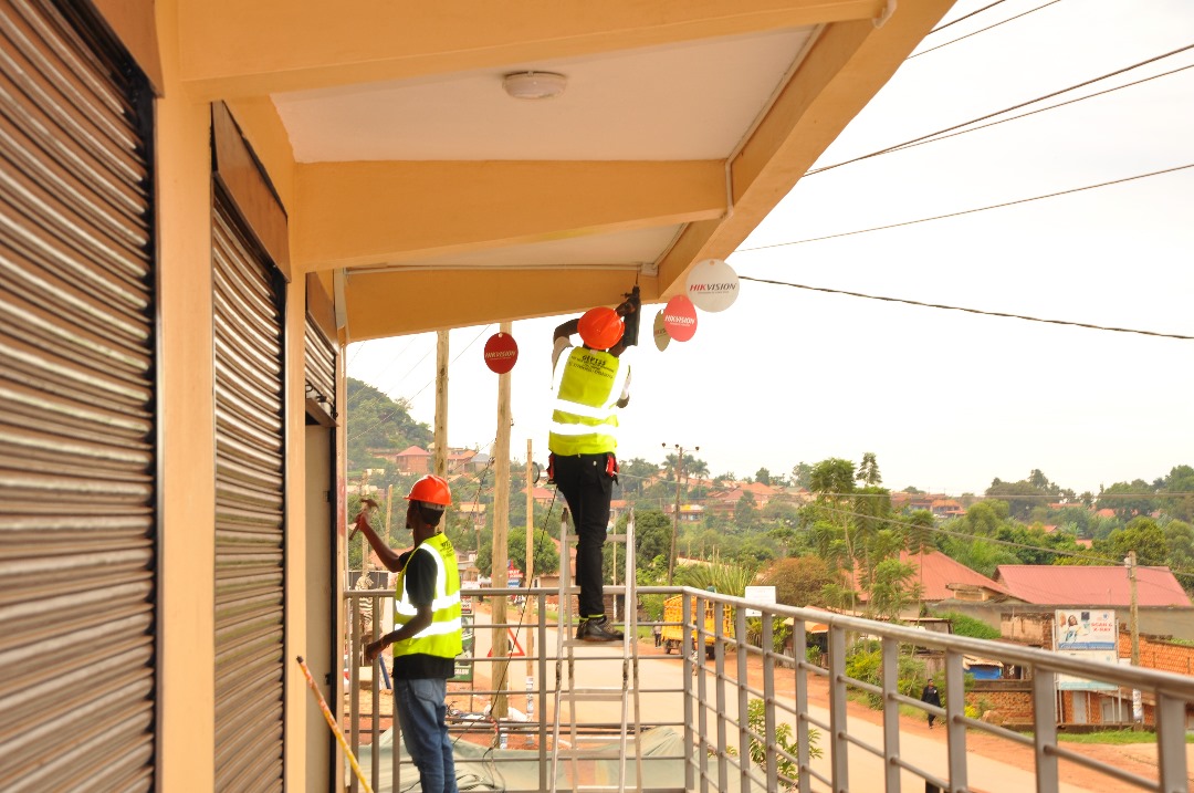 GEP TSS team on scaffolding installing CCTV cameras on a commercial building